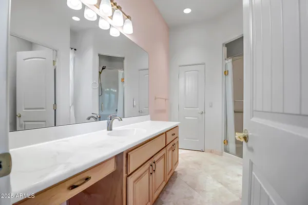 a bathroom with a sink a vanity and a mirror