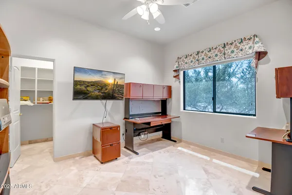 a workspace with furniture and window