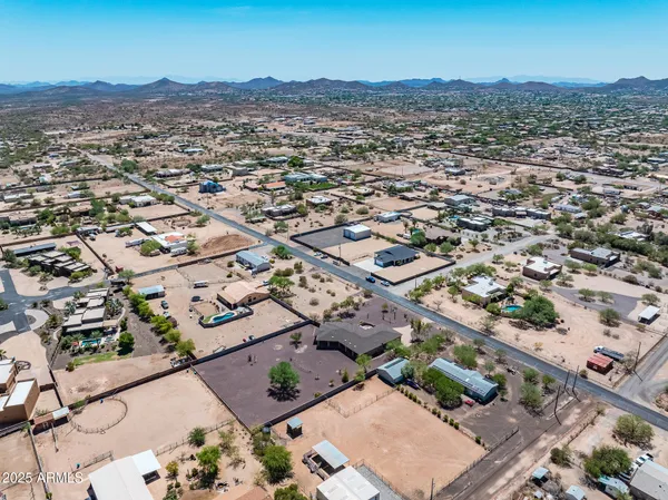 an aerial view of residential house with an ocean