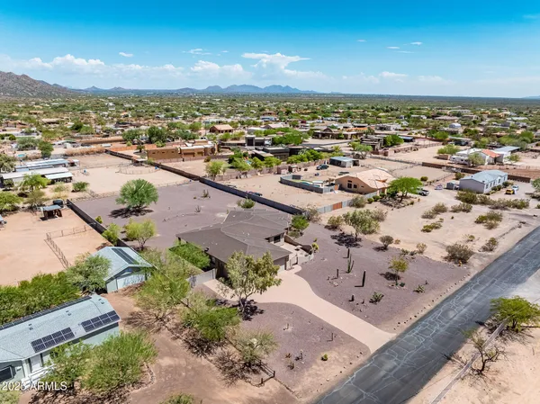 an aerial view of residential houses and outdoor space