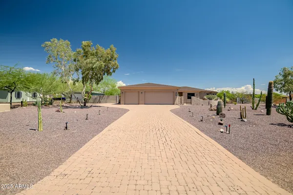 a swimming pool with a lawn chairs