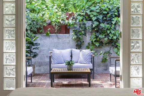 a view of a patio with furniture