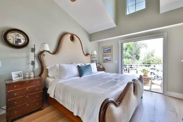 a bathroom with a sink toilet a mirror and shower