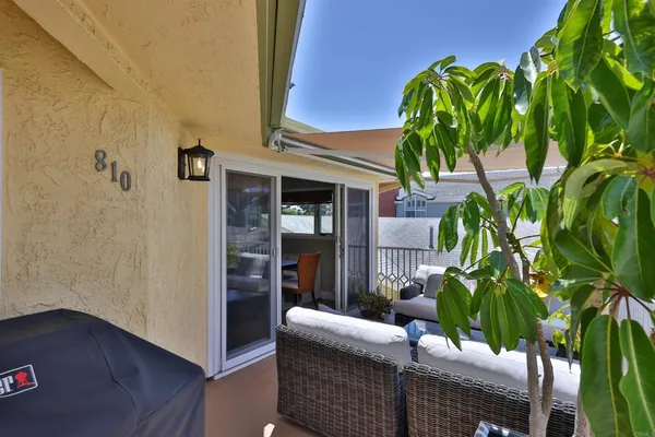 a outdoor living space with furniture and a potted plant