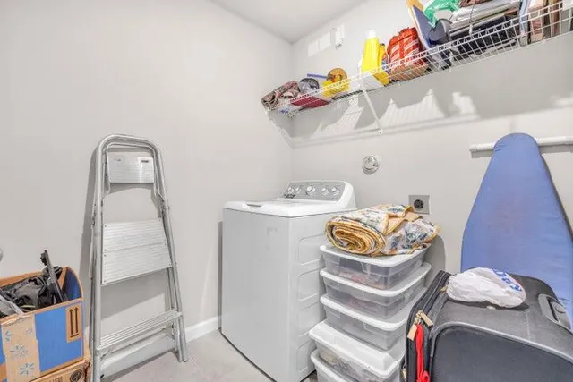 a bathroom with a sink mirror and vanity
