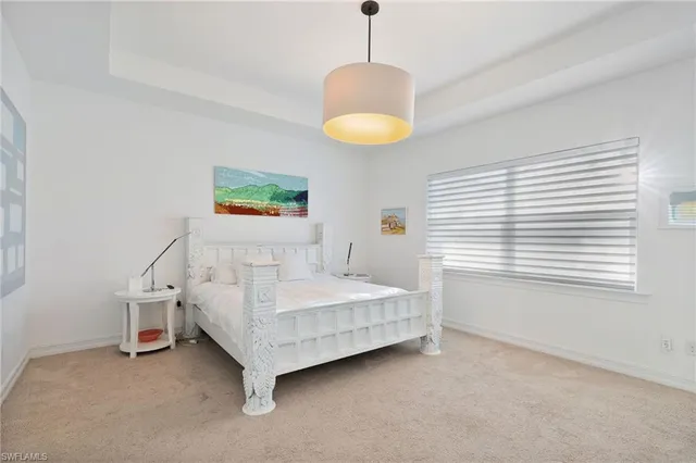 a bedroom with a bed a table and chair