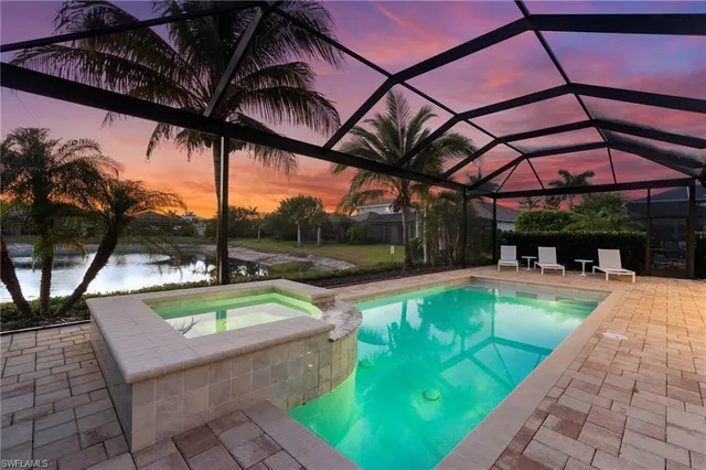 a view of swimming pool with a yard and sitting area