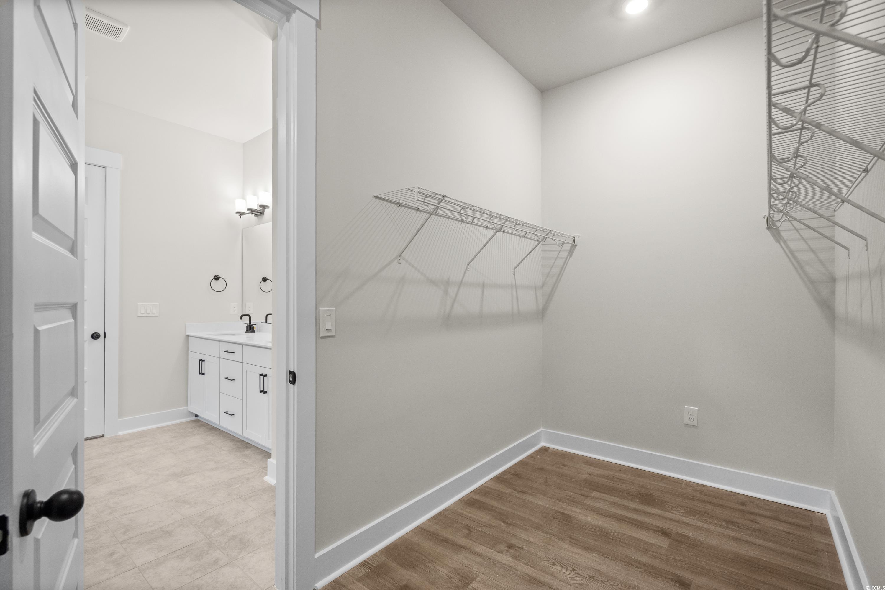 82 Bridge View Road Georgetown, SC 29440 - Photo 16 of 32 Spacious closet featuring light wood-type flooring