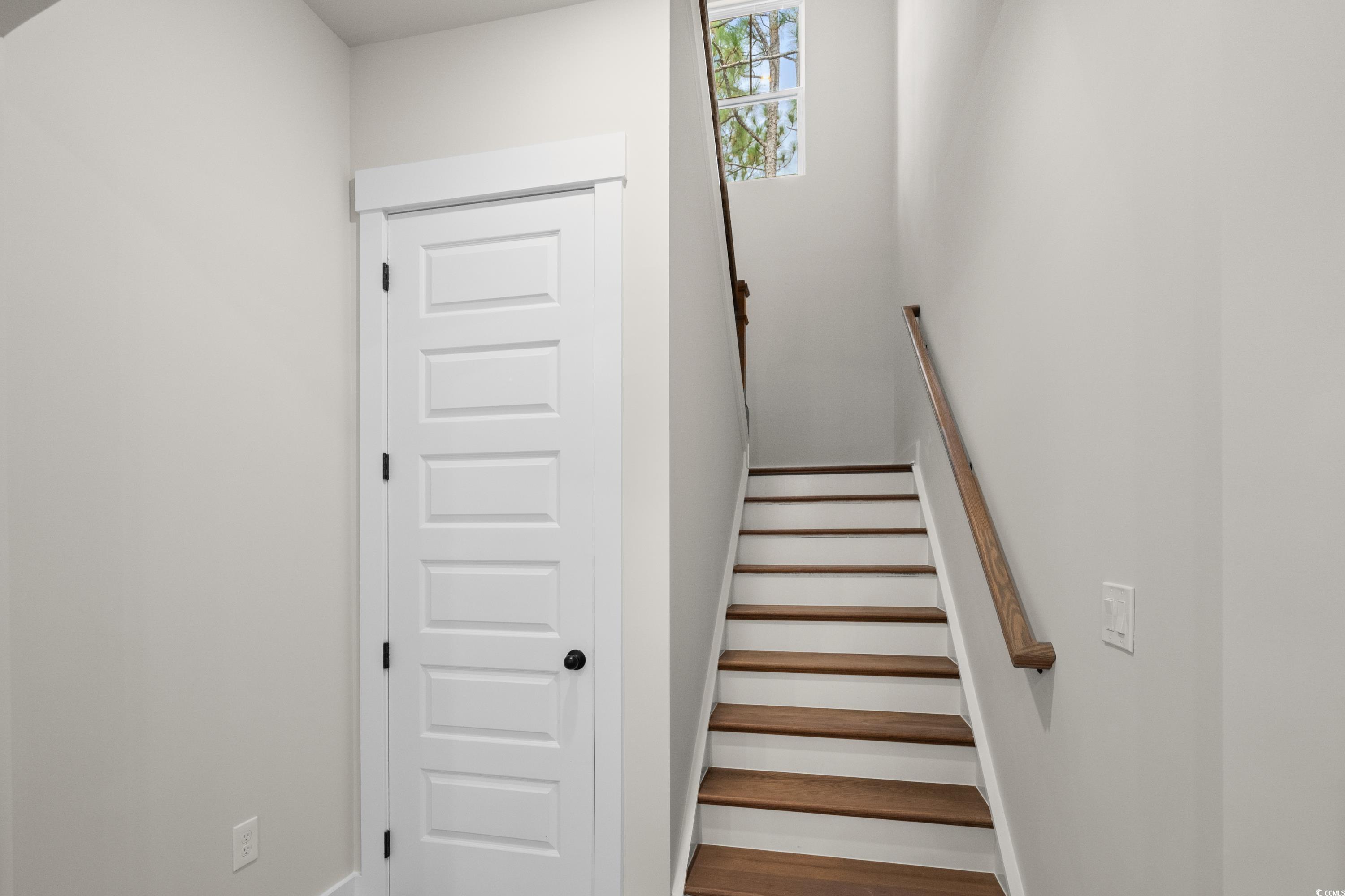 82 Bridge View Road Georgetown, SC 29440 - Photo 19 of 32 Staircase with wood finished floors and baseboards