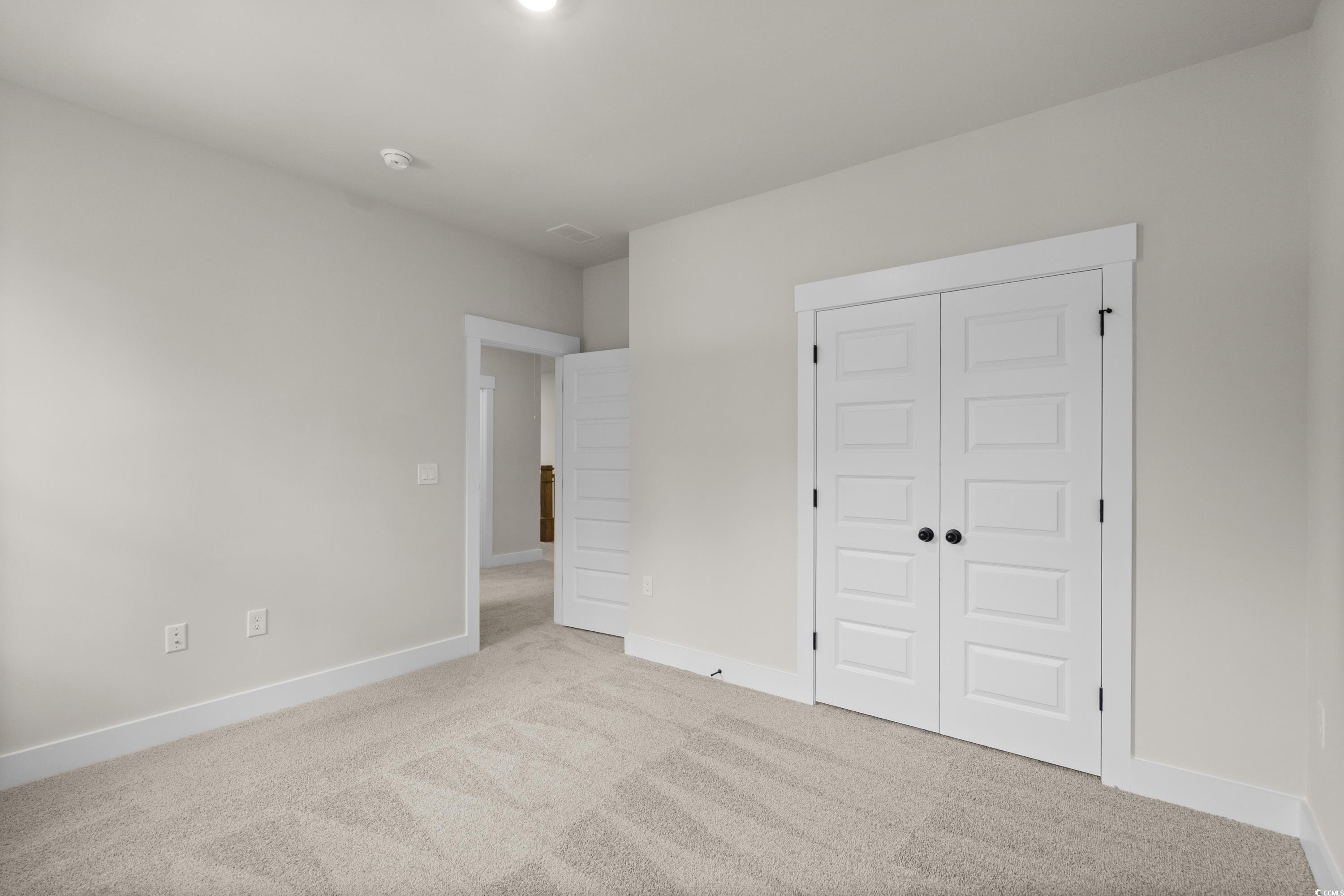 82 Bridge View Road Georgetown, SC 29440 - Photo 22 of 32 Unfurnished bedroom with carpet and a closet