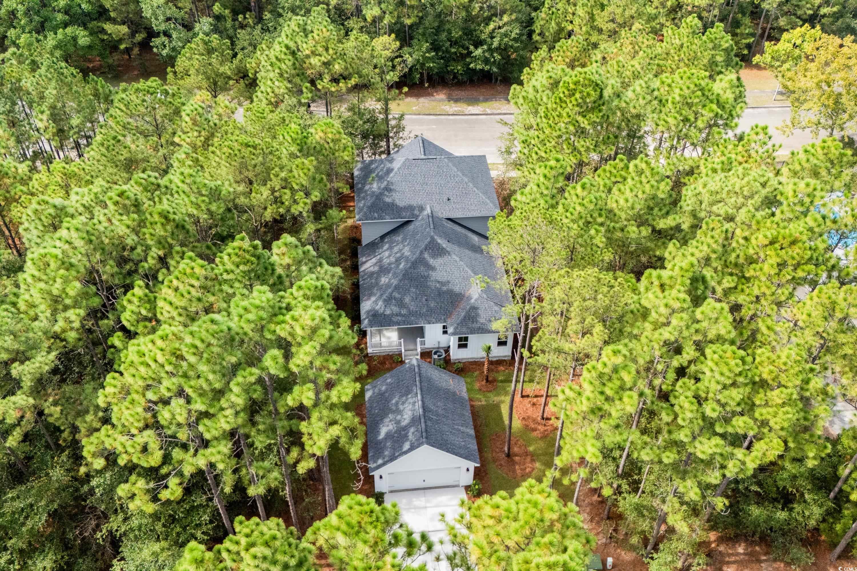 82 Bridge View Road Georgetown, SC 29440 - Photo 29 of 32 Aerial view of property and surrounding area featuring a tree filled landscape