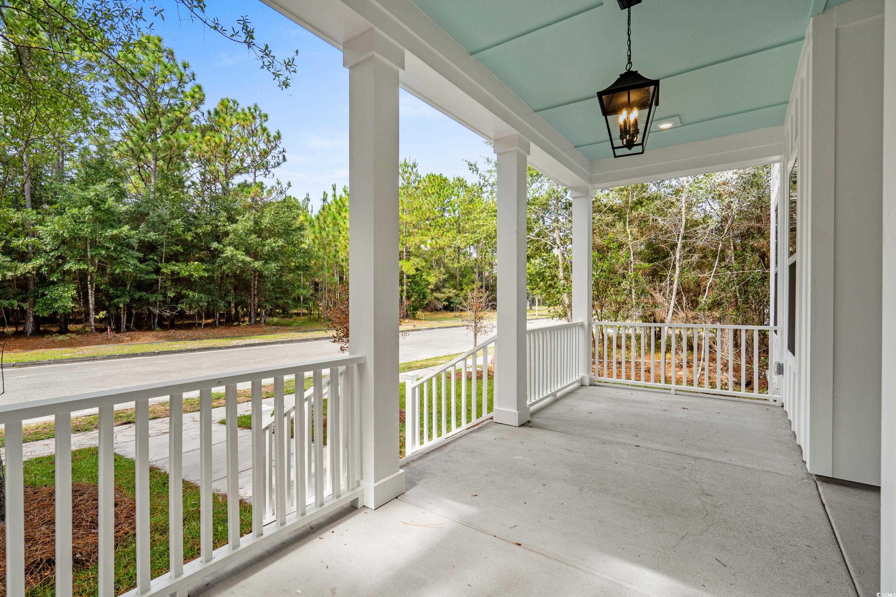 82 Bridge View Road Georgetown, SC 29440 - Photo 3 of 32 Porch featuring view of scattered trees