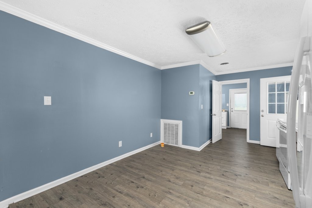 431 South Fair Street Morrison, TN 37357 - Photo 10 of 18 a view of an empty room with wooden floor and a window