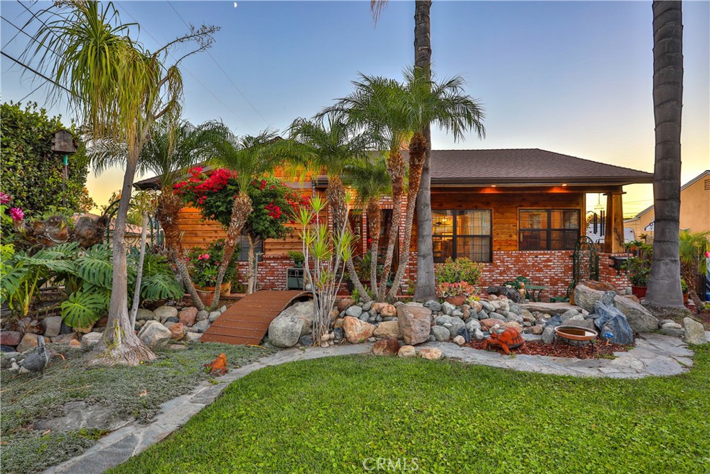 a front view of a house with a yard table and chairs