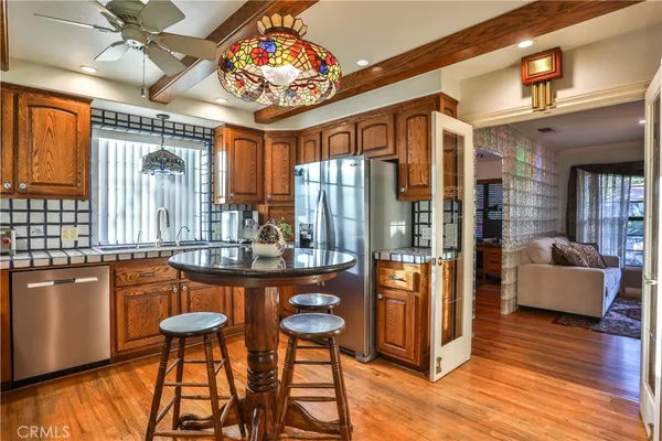 a very nice looking living room with a large window and wooden floor