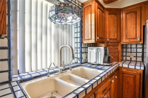 a kitchen with a sink and a window
