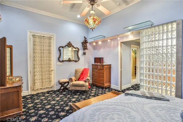 a living room with furniture windows and a chandelier