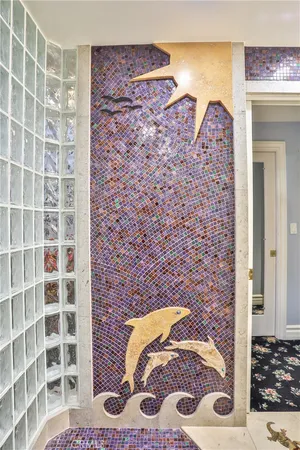a bathroom with a bathtub and shower