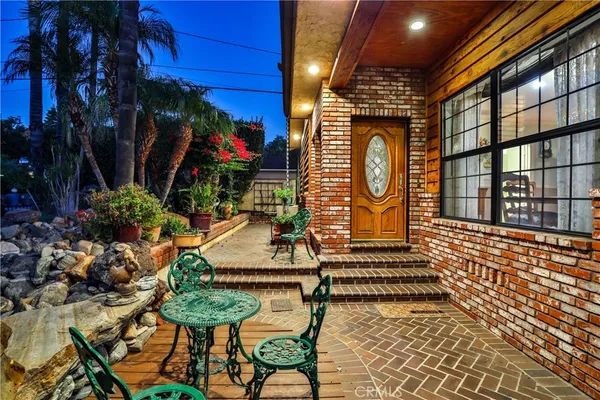 a view of a chairs and table in a patio