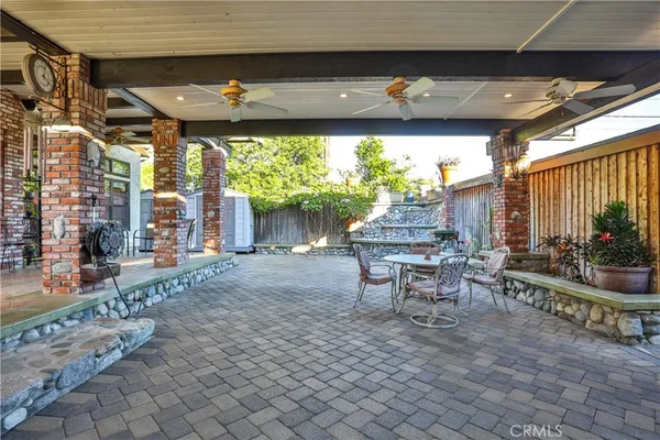 a patio with table and chairs