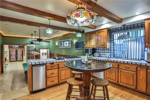 a kitchen with a table and chairs in it