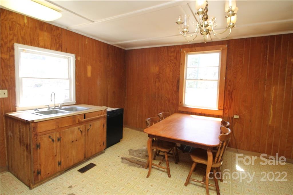 1931 Dan Sexton Road York, SC 29745 - Photo 12 of 22 a kitchen with a wooden table and chairs