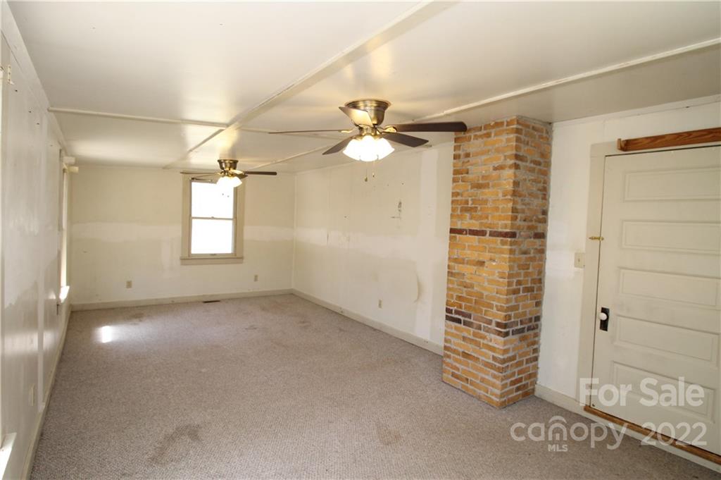 1931 Dan Sexton Road York, SC 29745 - Photo 14 of 22 an empty room with windows and fan