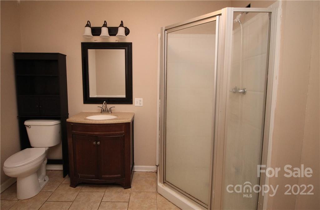 1931 Dan Sexton Road York, SC 29745 - Photo 18 of 22 a bathroom with a toilet sink and mirror