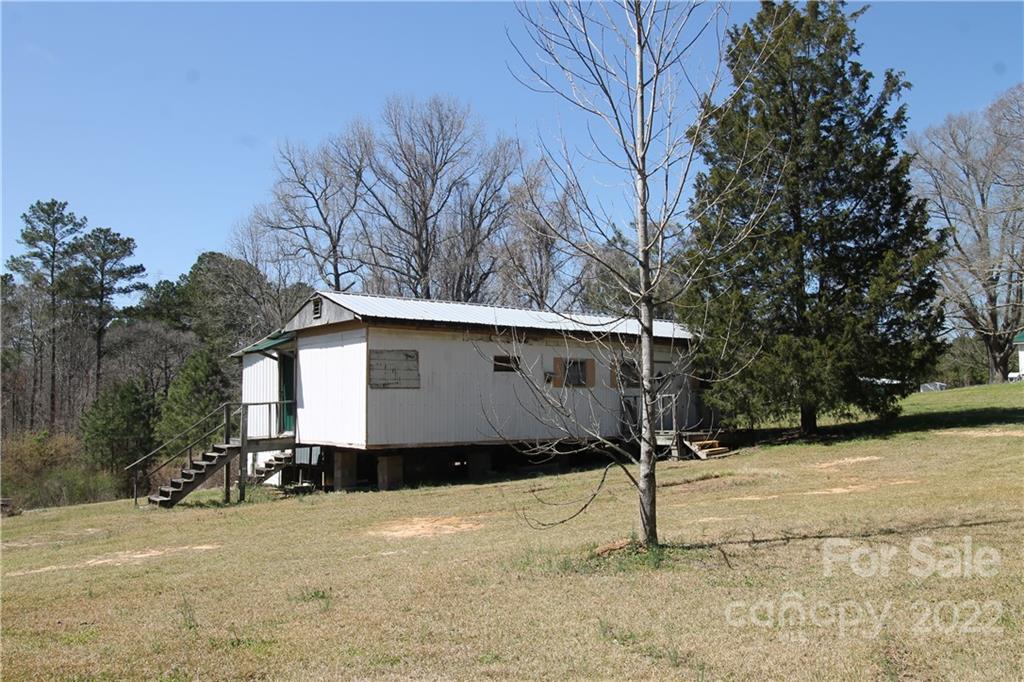 1931 Dan Sexton Road York, SC 29745 - Photo 6 of 22 a house with trees in front of it