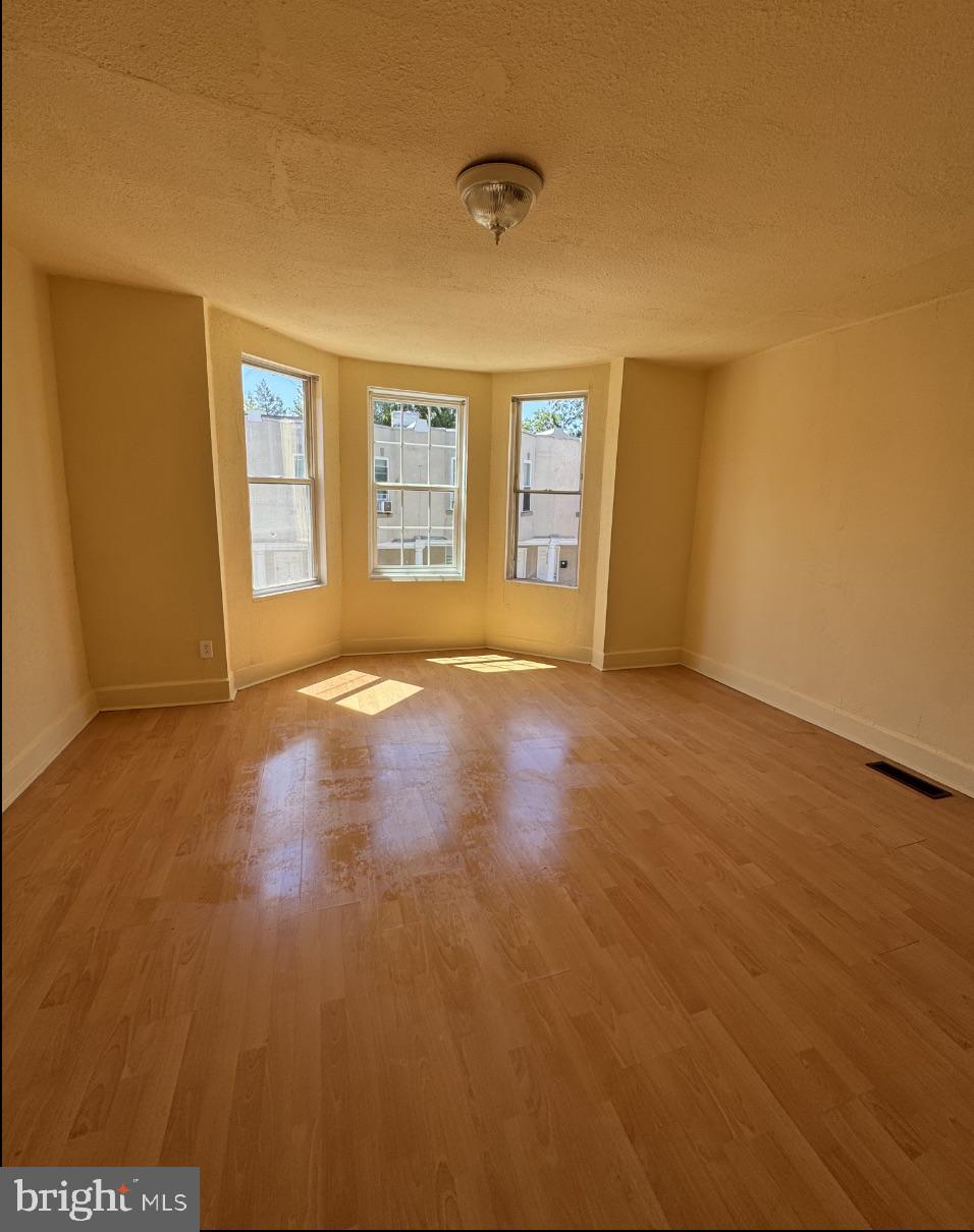 5515 Crowson Street Philadelphia, PA 19144 - Photo 3 of 10 a view of an empty room with a window