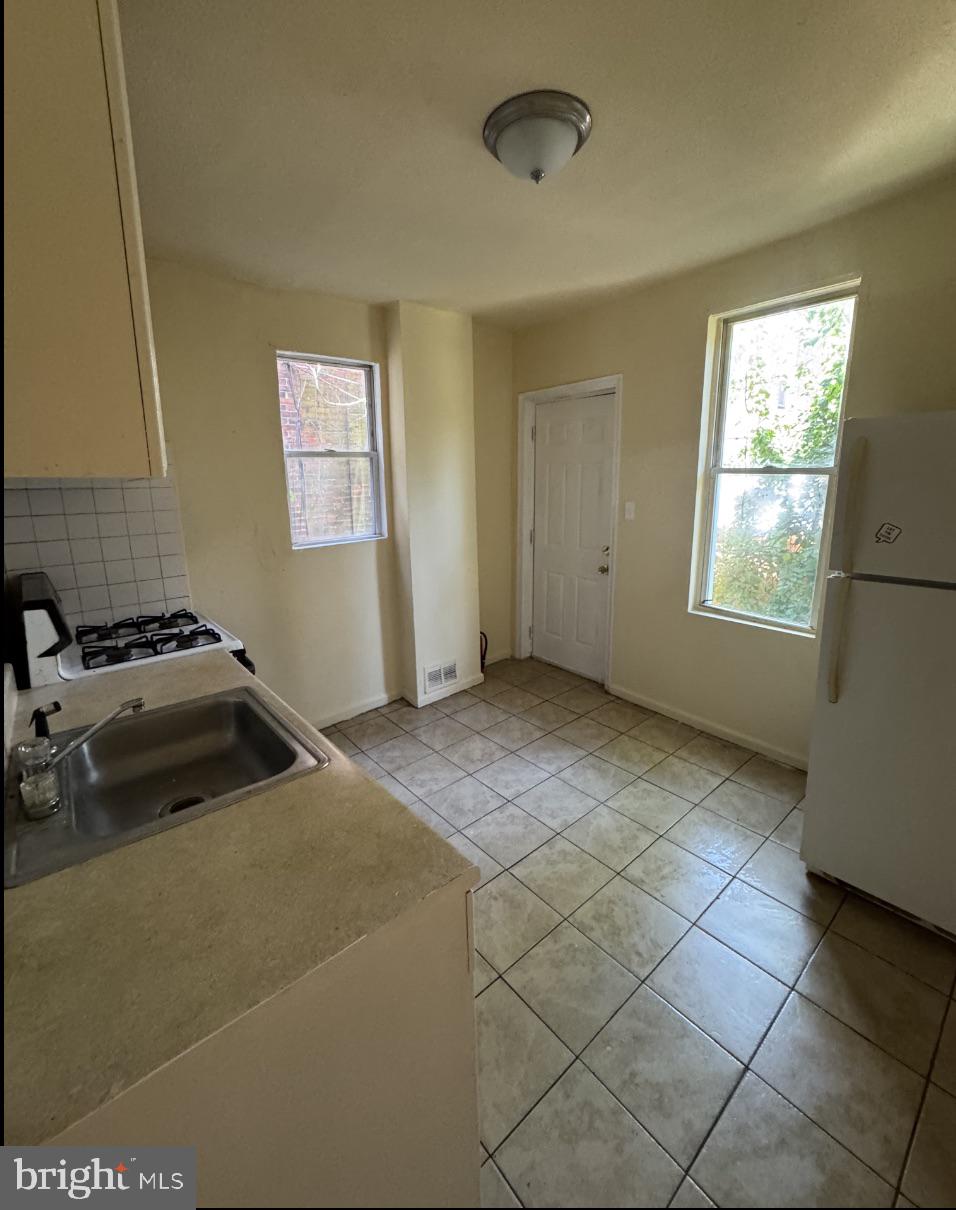 5515 Crowson Street Philadelphia, PA 19144 - Photo 5 of 10 a view of a livingroom with a window