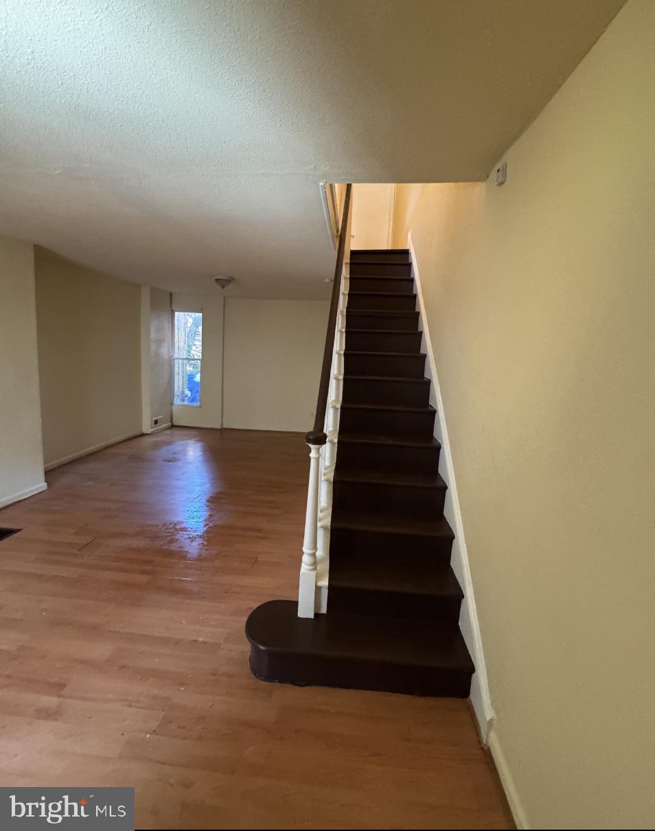 5515 Crowson Street Philadelphia, PA 19144 - Photo 6 of 10 a view of entryway and hall with wooden floor