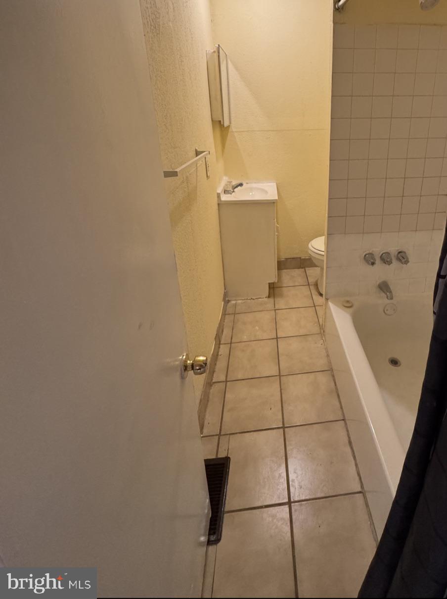 5515 Crowson Street Philadelphia, PA 19144 - Photo 7 of 10 a bathroom with a toilet and a shower
