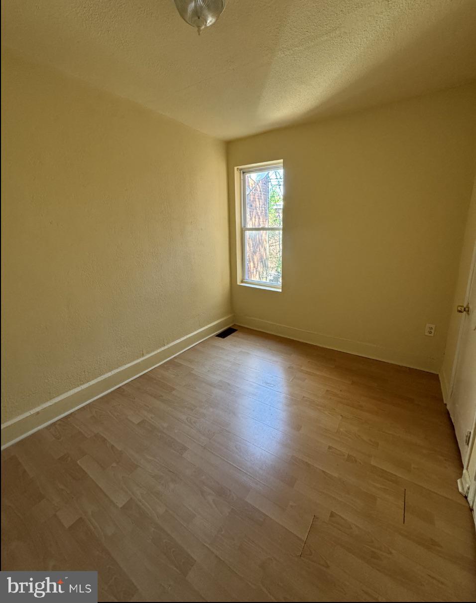 5515 Crowson Street Philadelphia, PA 19144 - Photo 8 of 10 an empty room with a window