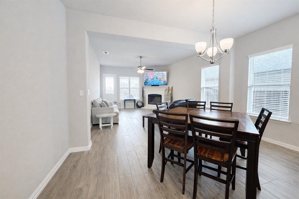 15044 Ted Trail Aledo, TX 76008 - Photo 11 of 37 a view of a a dining room with furniture window and wooden floor