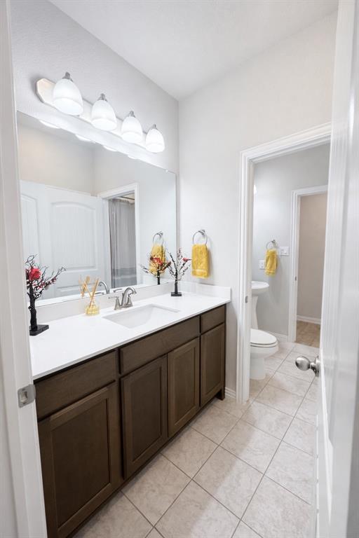 15044 Ted Trail Aledo, TX 76008 - Photo 17 of 37 a bathroom with a sink double vanity and a mirror