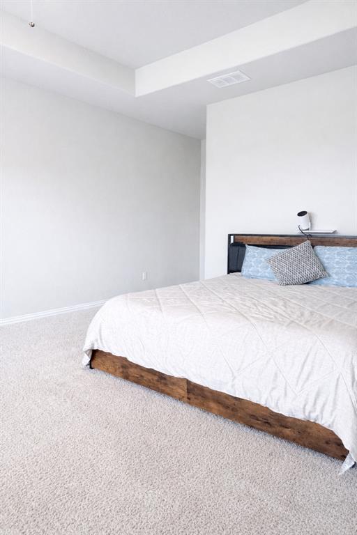 15044 Ted Trail Aledo, TX 76008 - Photo 22 of 37 a bedroom with a bed and a night stand