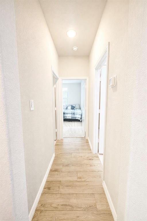 15044 Ted Trail Aledo, TX 76008 - Photo 27 of 37 a view of a hallway with a white walls