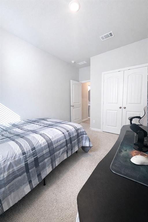 15044 Ted Trail Aledo, TX 76008 - Photo 29 of 37 a bedroom with a bed window and a couch