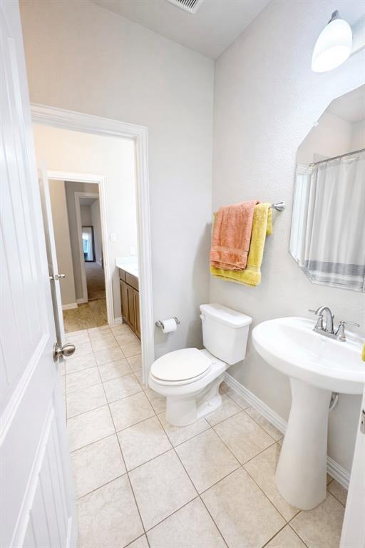 15044 Ted Trail Aledo, TX 76008 - Photo 30 of 37 a bathroom with a sink toilet and shower