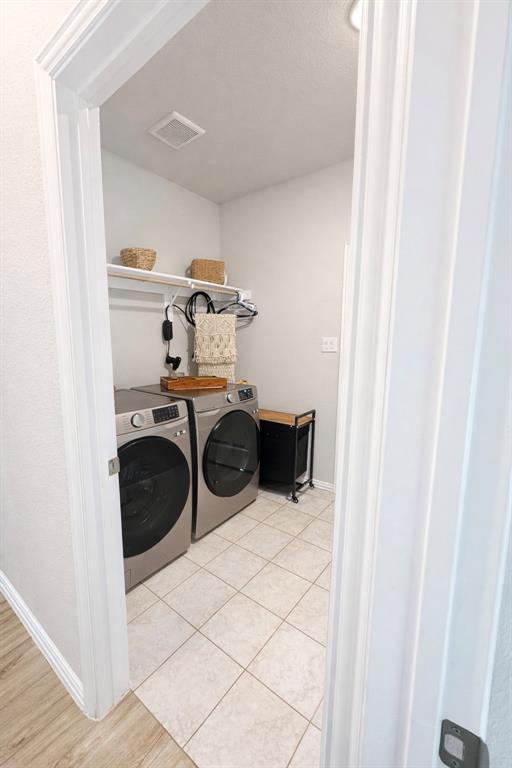 15044 Ted Trail Aledo, TX 76008 - Photo 31 of 37 a utility room with dryer and washer