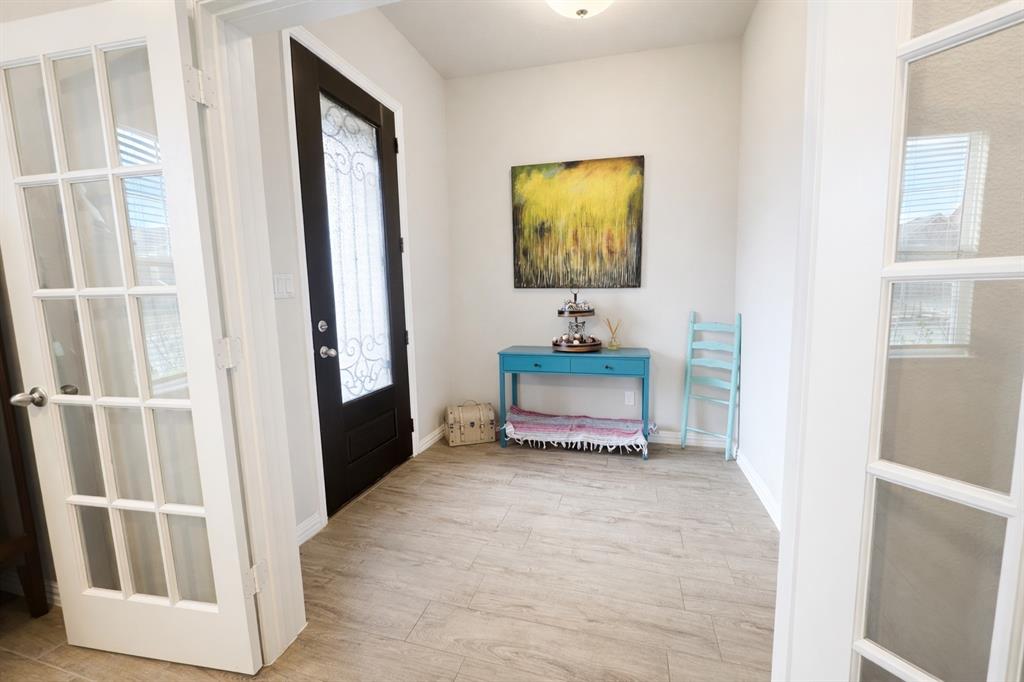 15044 Ted Trail Aledo, TX 76008 - Photo 4 of 37 a living room with furniture and a flat screen tv