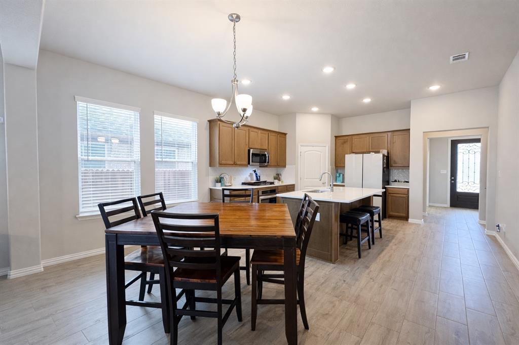15044 Ted Trail Aledo, TX 76008 - Photo 9 of 37 a dining room with furniture window and wooden floor