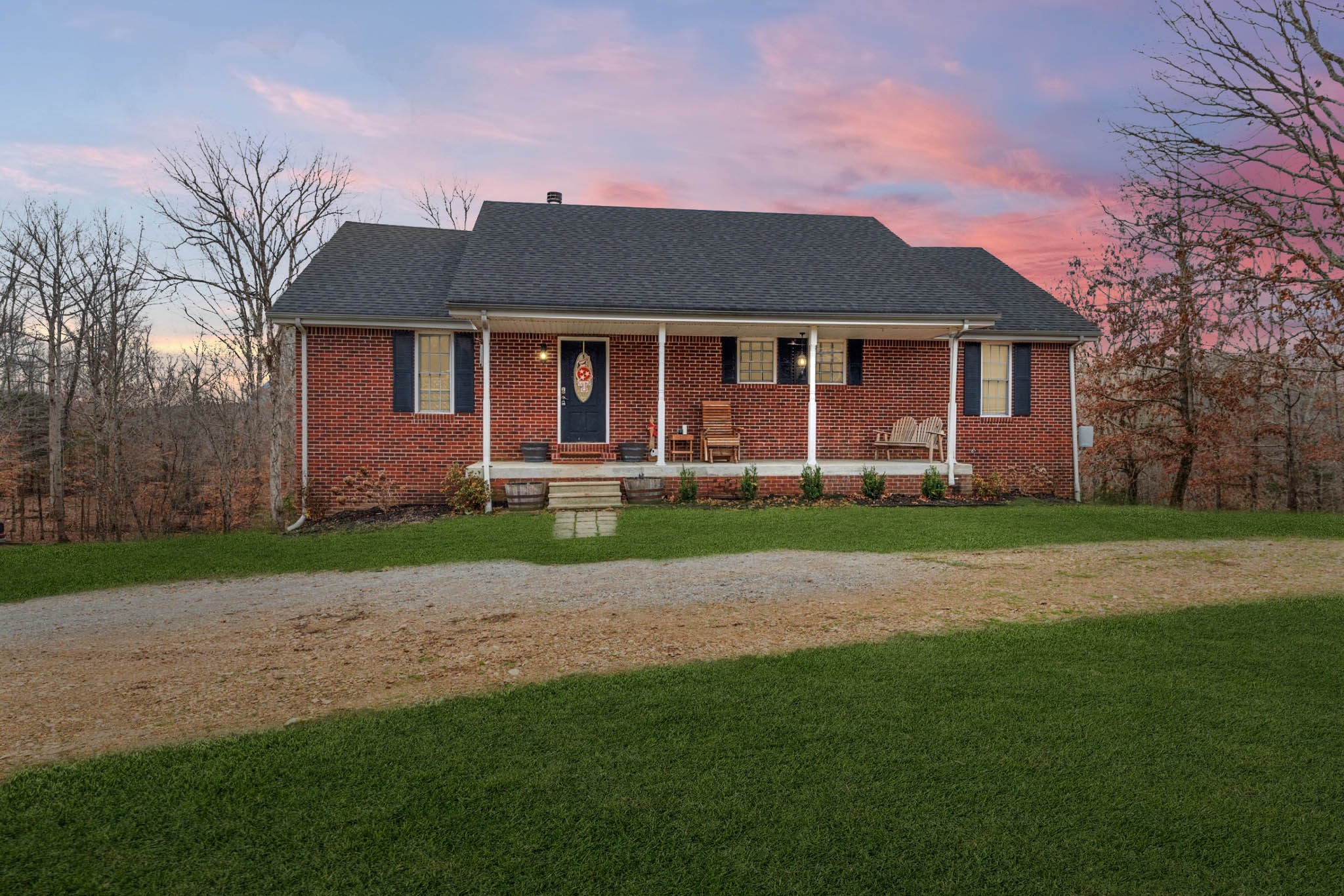 2323 Nubbin Ridge Road Dickson, TN 37055 - Photo 1 of 51 a front view of a house with a yard and trees