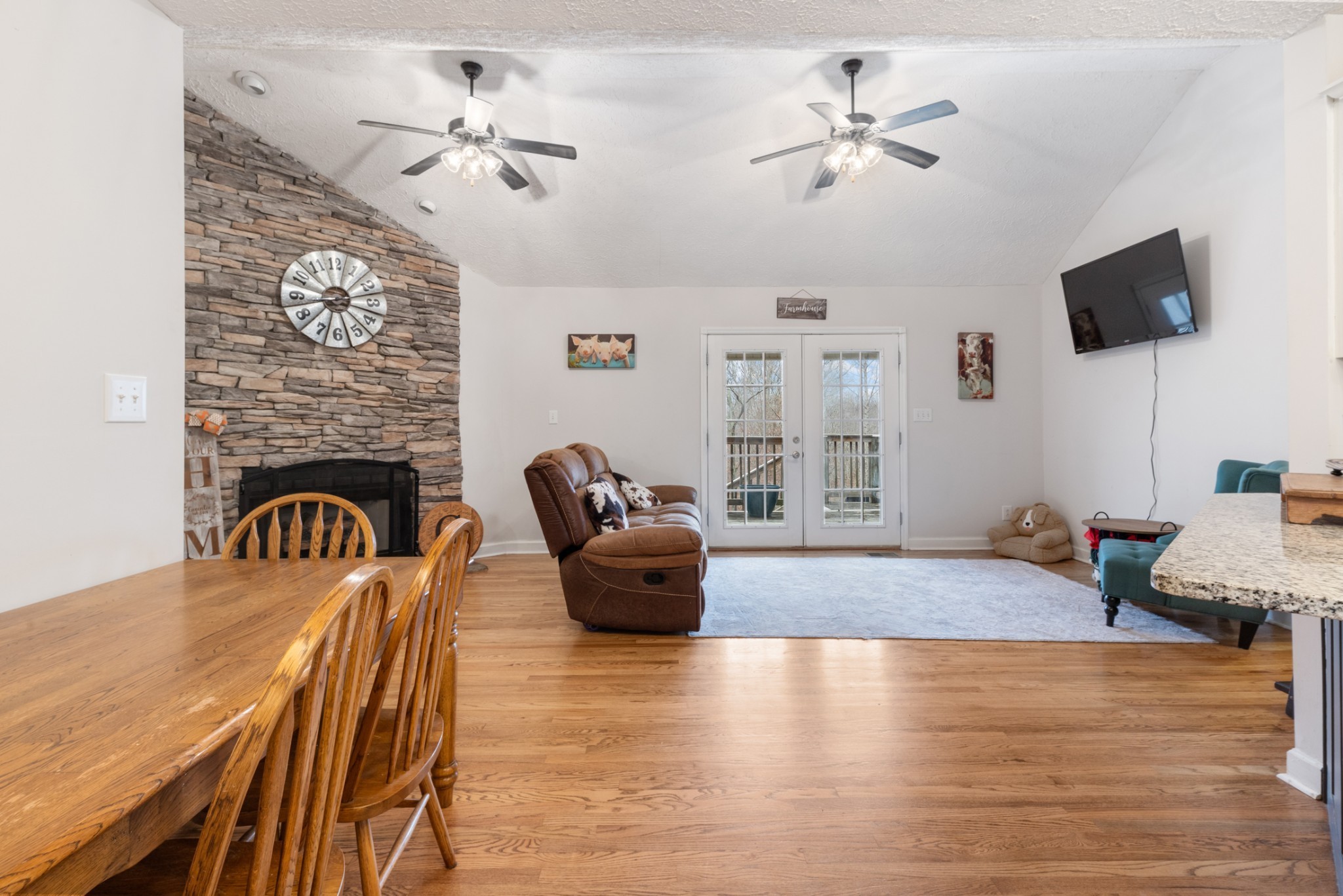 2323 Nubbin Ridge Road Dickson, TN 37055 - Photo 18 of 51 a living room with furniture a fireplace and a flat screen tv