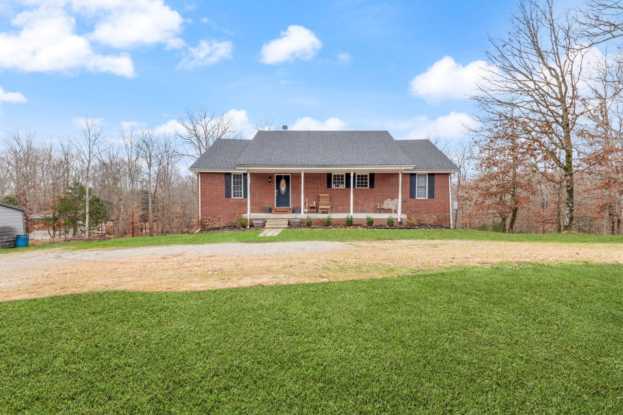 2323 Nubbin Ridge Road Dickson, TN 37055 - Photo 2 of 51 a front view of house with yard and green space