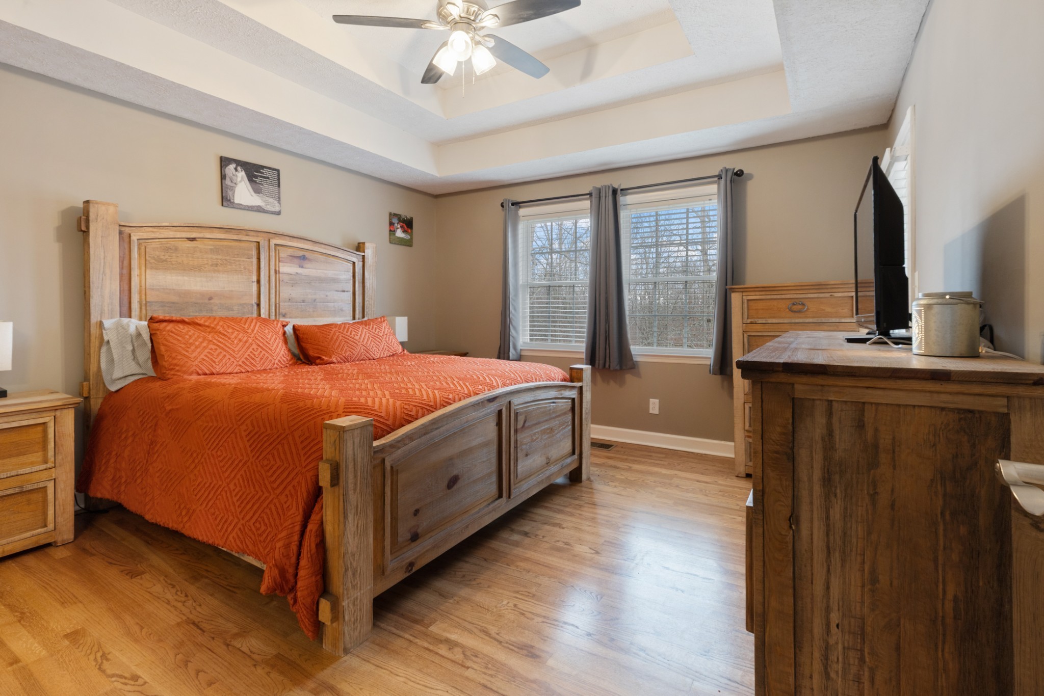 2323 Nubbin Ridge Road Dickson, TN 37055 - Photo 24 of 51 a bedroom with a bed and a chandelier