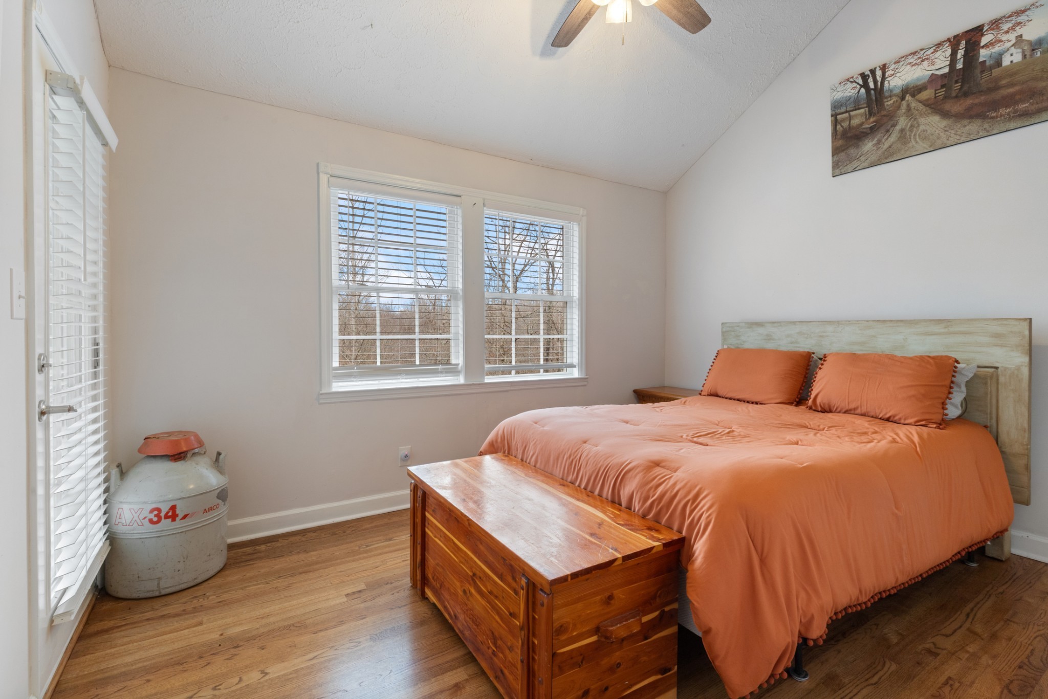 2323 Nubbin Ridge Road Dickson, TN 37055 - Photo 30 of 51 a bed sitting in a bedroom next to a window