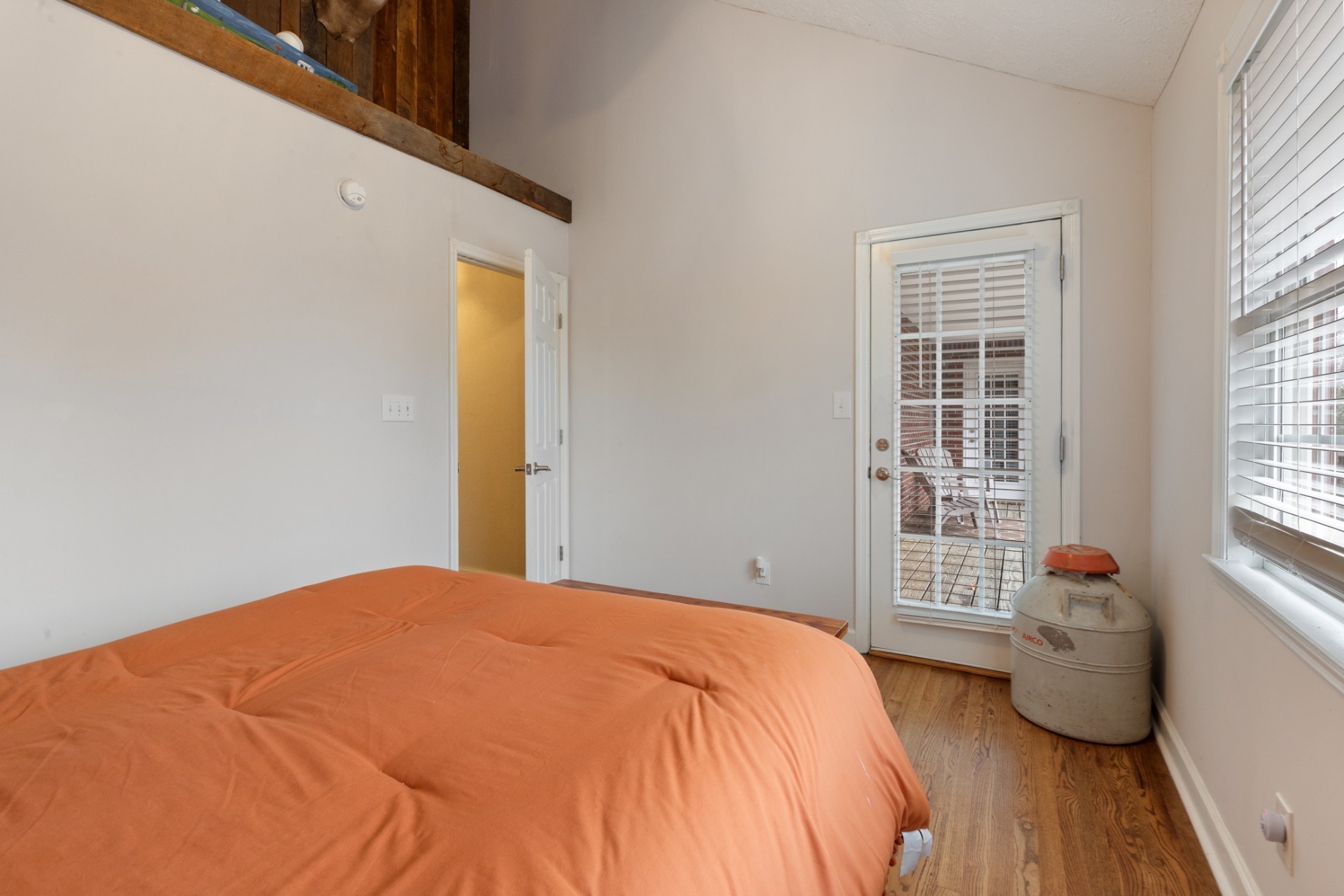 2323 Nubbin Ridge Road Dickson, TN 37055 - Photo 31 of 51 a bedroom with a bed and wooden floor