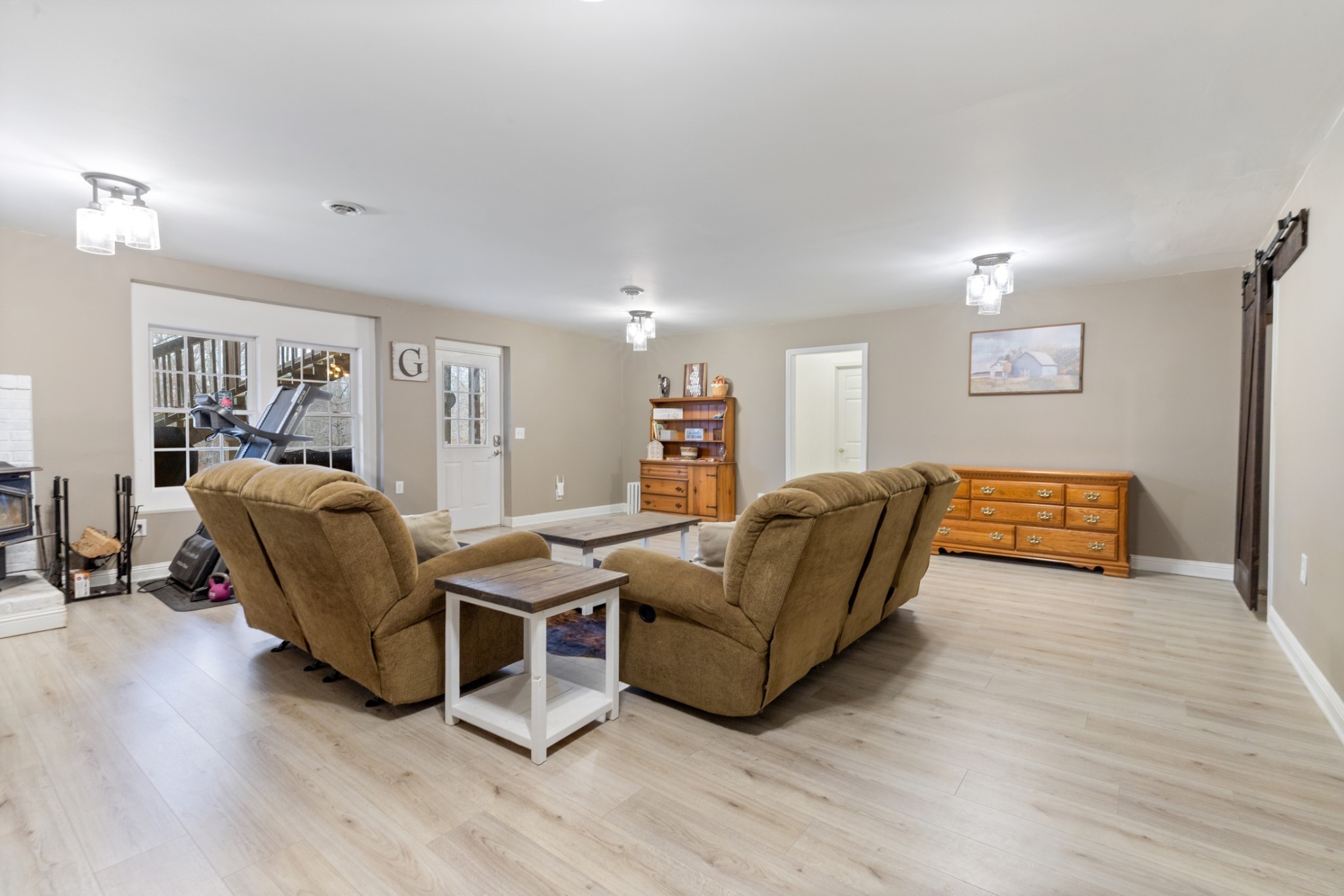2323 Nubbin Ridge Road Dickson, TN 37055 - Photo 36 of 51 a living room with furniture and a wooden floor